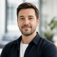 Portrait of a professional Polish author with a trustworthy and approachable appearance, suitable for an editorial website.